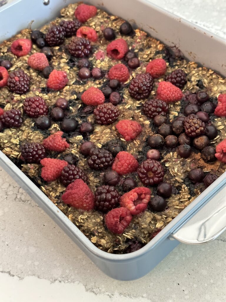 Healthy Summer Berry Oatmeal Bake hot out of the oven with juicy goodness