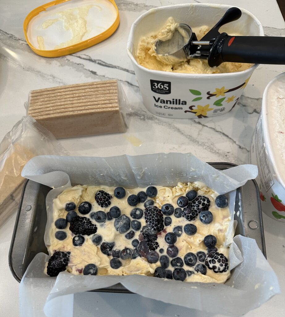 Smash in a layer of mixed berries in the center of the No Bake Mixed Berry Ice Cream Loaf Cake