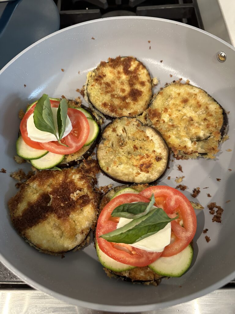 Stacking your Warm Eggplant Zucchini Caprese Stacks