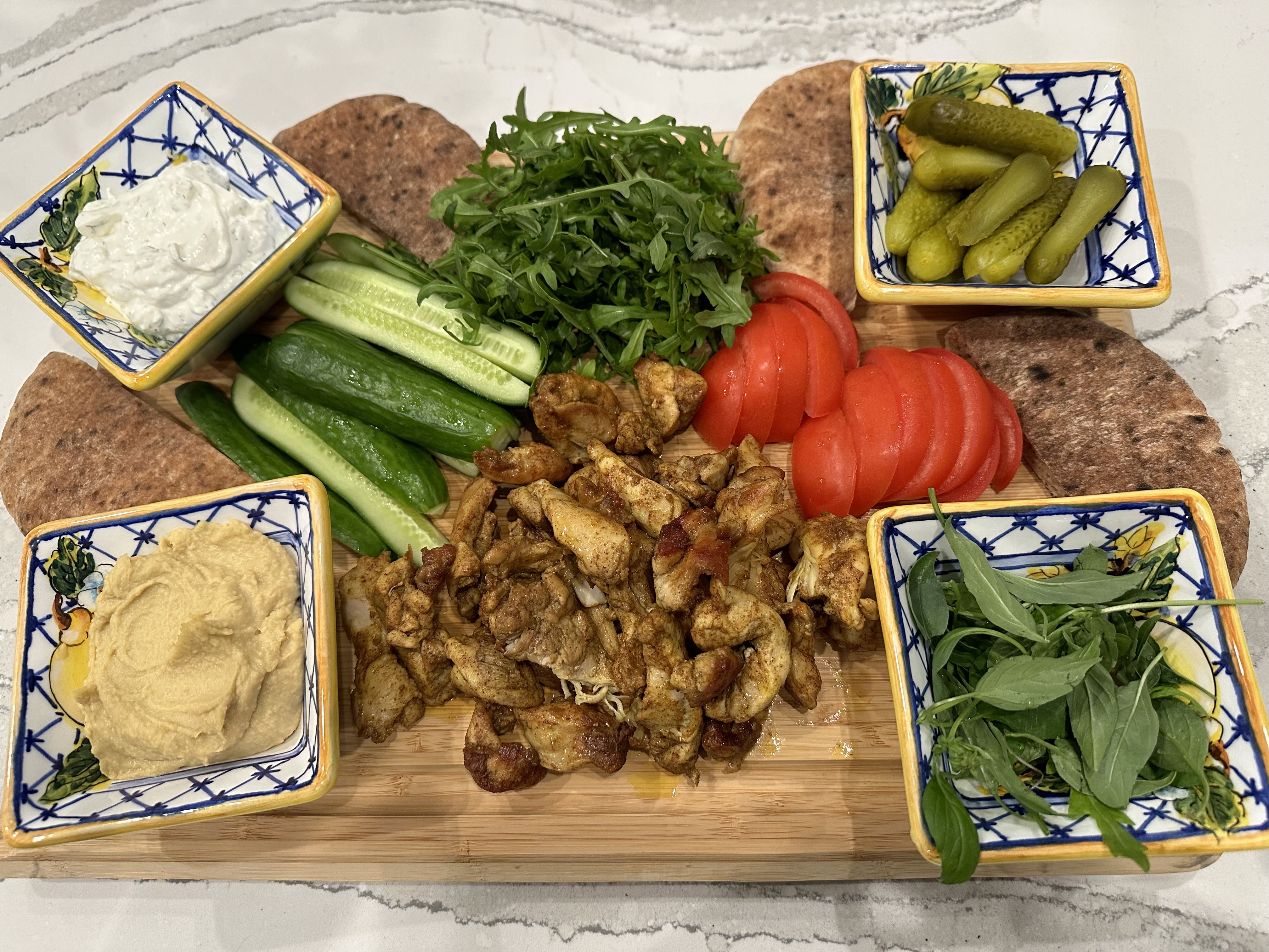 Customize Chicken Shawarma Pita Board with your favorite toppings!